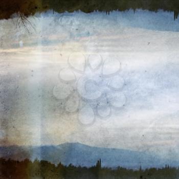 Double printed vintage discolorated photograph of trees, distant city lights and mountain horizon. Abstract illustration.