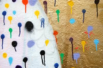 Detail of a wall covered with dots. Dripping paint. Graffiti urban street art.