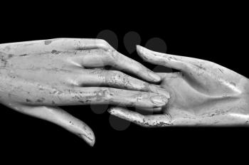 Weathered hands of plastic mannequin doll. Black and white.