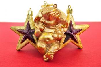 Angel and golden christmas stars baubles. Seasonal decoration.