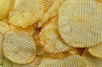 Potato chips food texture. Salty snack background.