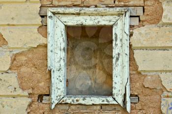 Empty wooden window frame and chipped wall texture. Grunge background.
