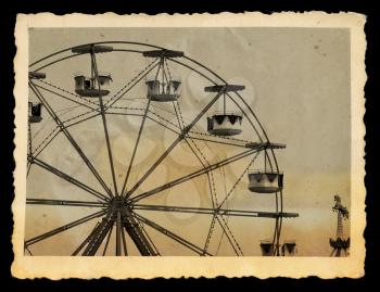 Vintage photograph of ferris wheel and carousel horse in amusement park.