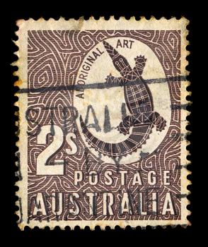 AUSTRALIA - CIRCA 1948. Vintage postage stamp printed by the Australian Post with aboriginal art rock carving of a crocodile illustration, circa 1948.