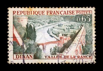 FRANCE - CIRCA 1963. Vintage canceled postage stamp with town of Dinan and river Rance illustration, circa 1963.