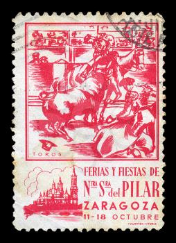 SPAIN - CIRCA 1930's. Vintage postage stamp for a fair and fiesta at the Basilica Cathedral de Nuestra Senora del Pilar in the city of Zaragoza with matador and cavaleiro bullfighting illustration, circa 1930's.