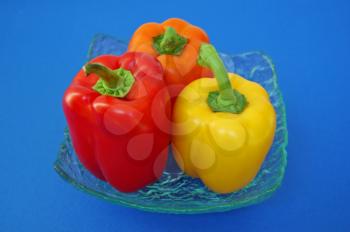 Red, orange and yellow peppers variety. Vegetables background.
