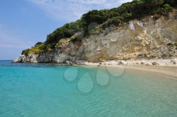 Blue sea water and beach on Marathonisi island in Zakynthos, Greece.