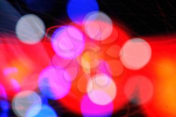 Light abstraction blurry colorful dots and flashing shapes background pattern.