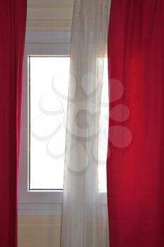 White and red window curtains abstract interior.