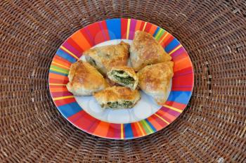 Spanakopita spinach pie with feta cheese and crispy filo dough. Greek food.