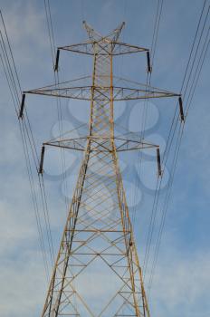 Transmission tower electricity pylon steel industrial structure and power lines.