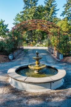 A view of a fountain and arbor in Seatac, Washington.