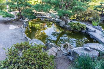 A pond reflects the surrounding Japanese garden in Seatac, Washington.