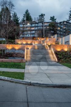 A outdoor stairway in West Seattle is lit by soft lights.