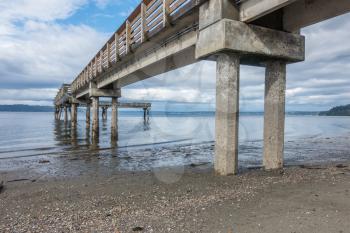 A view from beneath the pier at Dash Point, Washington. The tide is low.