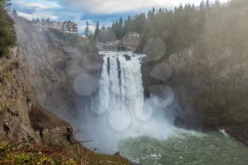 A heavy mist rises as Snoqualmie Falls rushes powerfully.