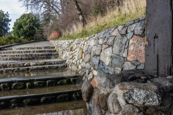 A view of stairs and a rock wall at Lincoln Park in West Seattle, Washington.