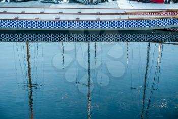 Mast of boats are reflected in the smooth water of a marina located on Lake Washington near Seattle.