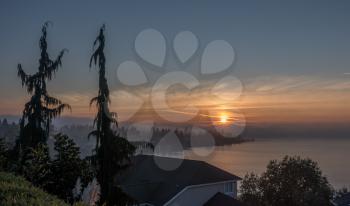 A fog creates a surreal sunset near Brown's Point, Washington.