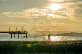 A silhouette shot of the pier in Des Moines, Washington.