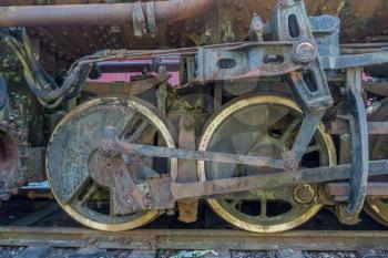 Macro shot of old rusted train wheels.