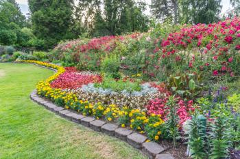 A view of a lawn and flower garden at Point Defiance Park in Tacoma, Washington.