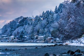 A view of Three Tree Point in Burien, Washington. It is evening on a winter day.