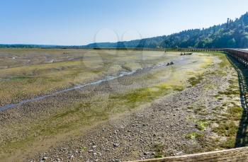 Mud flats and boardwalk at the Nisqually Wetlands near Olymp[ia, Washington.