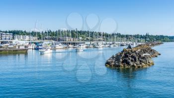 A view of the sea wall and marina in Des Moines, Washington.