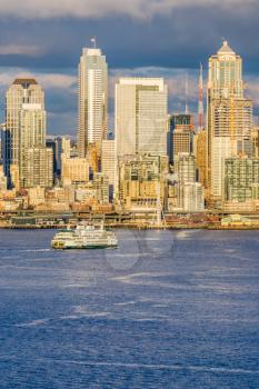 A ferry approaches skyscrapers in Seattle, Washington.