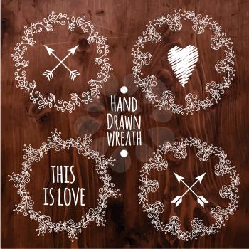 Hand drawn set of  hipster vintage wedding wreaths, words and hearts for invitations and decorations