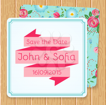 Vintage floral wedding invitation square shape on a wooden background