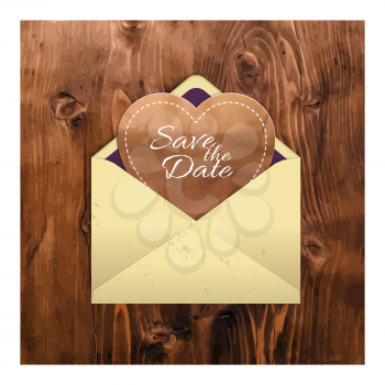 Manila envelope with a heart on a wooden background. In the style of handmade. For your postcards, greetings and invitations