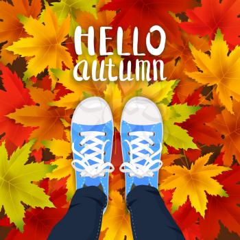 Hello Autumn lettering leaves background template with red, orange, brown and yellow maple leaves legs top view in shoes sneakers