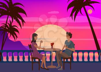 Cute couple sitting at table, drinking tea or coffee and talking in open air cafe sunset sea ocean