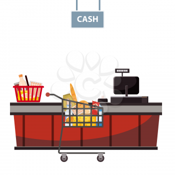 Cashier counter in the supermarket, shop, store with a basket full of groceries and grocery cart full of groceries
