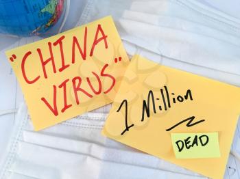 China virus Coronavirus COVID-19 infection medical cases and deaths . COVID respiratory disease influenza statistics hand written on surgical mask and earth globe background