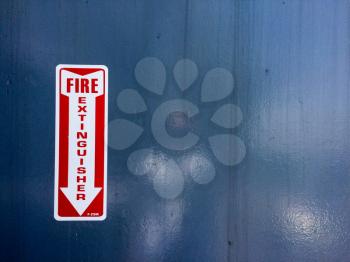 Red white fire extinguisher arrow sign on USS Iowa naval warship destroyer battleship