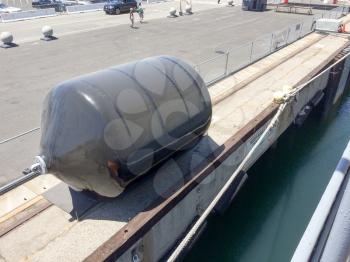 Large rubber naval marine inflated hull dock bumper guard on USS Iowa naval warship destroyer battleship