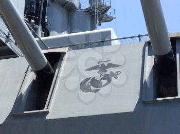 Long range navy guns and turret with US Marine Corps logo on USS Iowa naval warship destroyer battleship