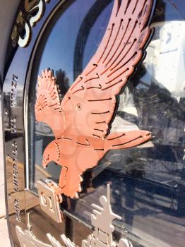 Brass copper color American eagle bird emblem on USS Iowa naval warship destroyer battleship