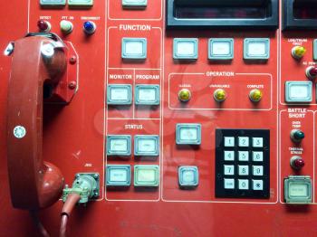 Emergency use only red phone hotline call button switch concept on USS Iowa naval warship destroyer battleship
