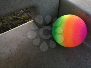 Modern art rainbow sphere geometric shapes in space on gray concrete