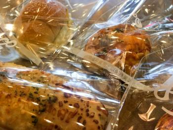 Fresh baked soft bread at famous bakery in cellophane plastic bags