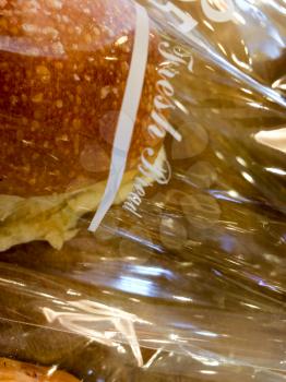 Fresh baked soft bread at famous bakery in cellophane plastic bags