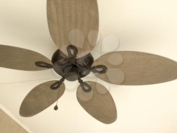 Ceiling fan on white background overhead with big leaf blades