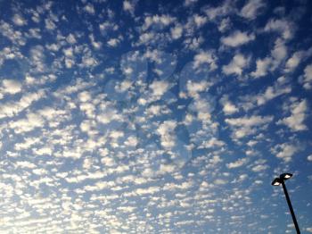 amazing blue sky cirrocumulus astrocumulus clouds and light pole
