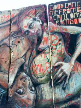 Urban street art on Berlin Wall section in california museum