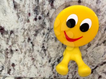 Happy fun yellow smiling emoji couple with peace sign dental toys